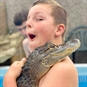 Boy Holding Alligator